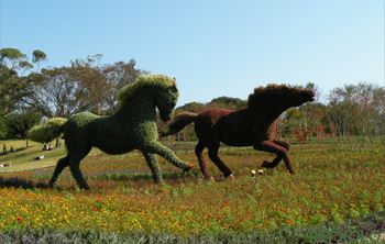 野を駆ける2頭の馬（木を植えた男の一部）